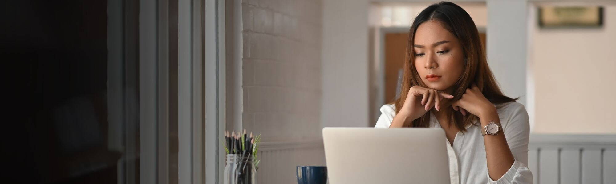 Image of woman working on laptop