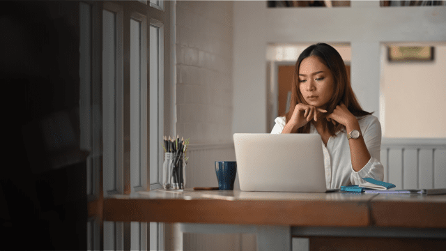 Image of woman working on laptop